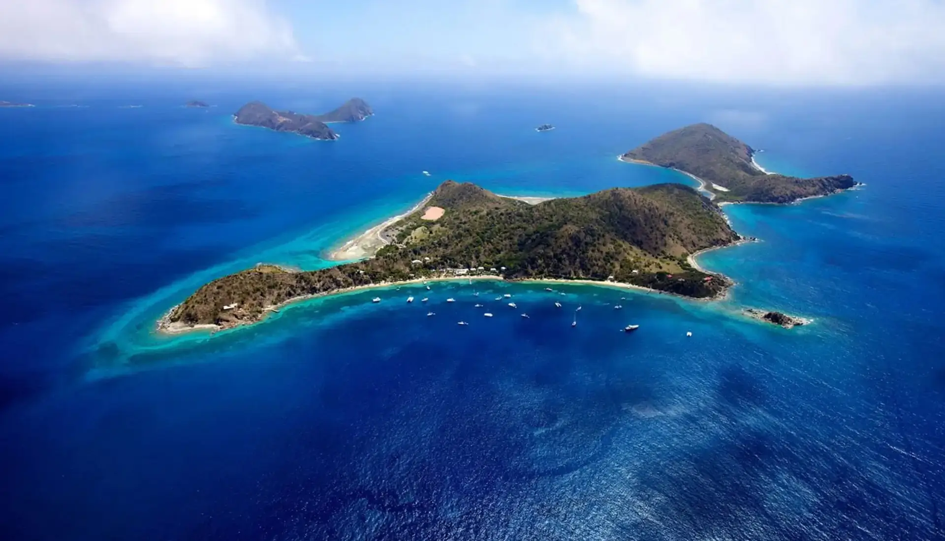Aerial view of Cooper Island with yachts anchored in Manchioneel Bay